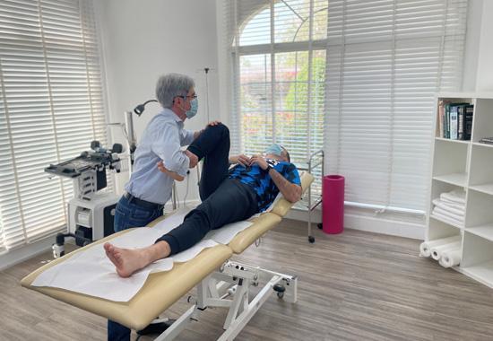 A Chiropractor Treating an Athlete